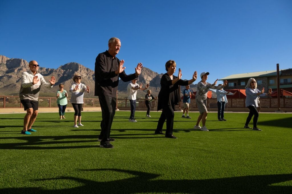 seniors doing an exercise class on the lawn