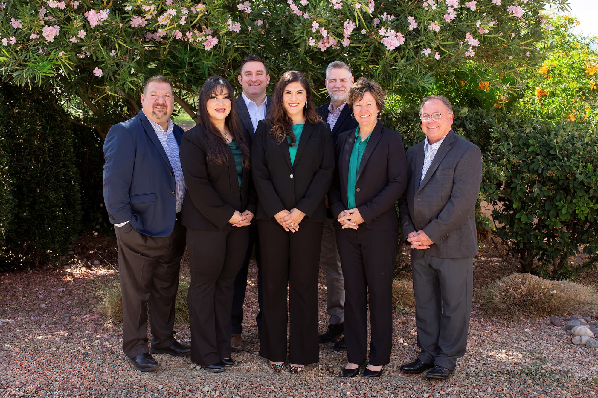 a group photo of the executive leadership team at La Posada at Pusch Ridge