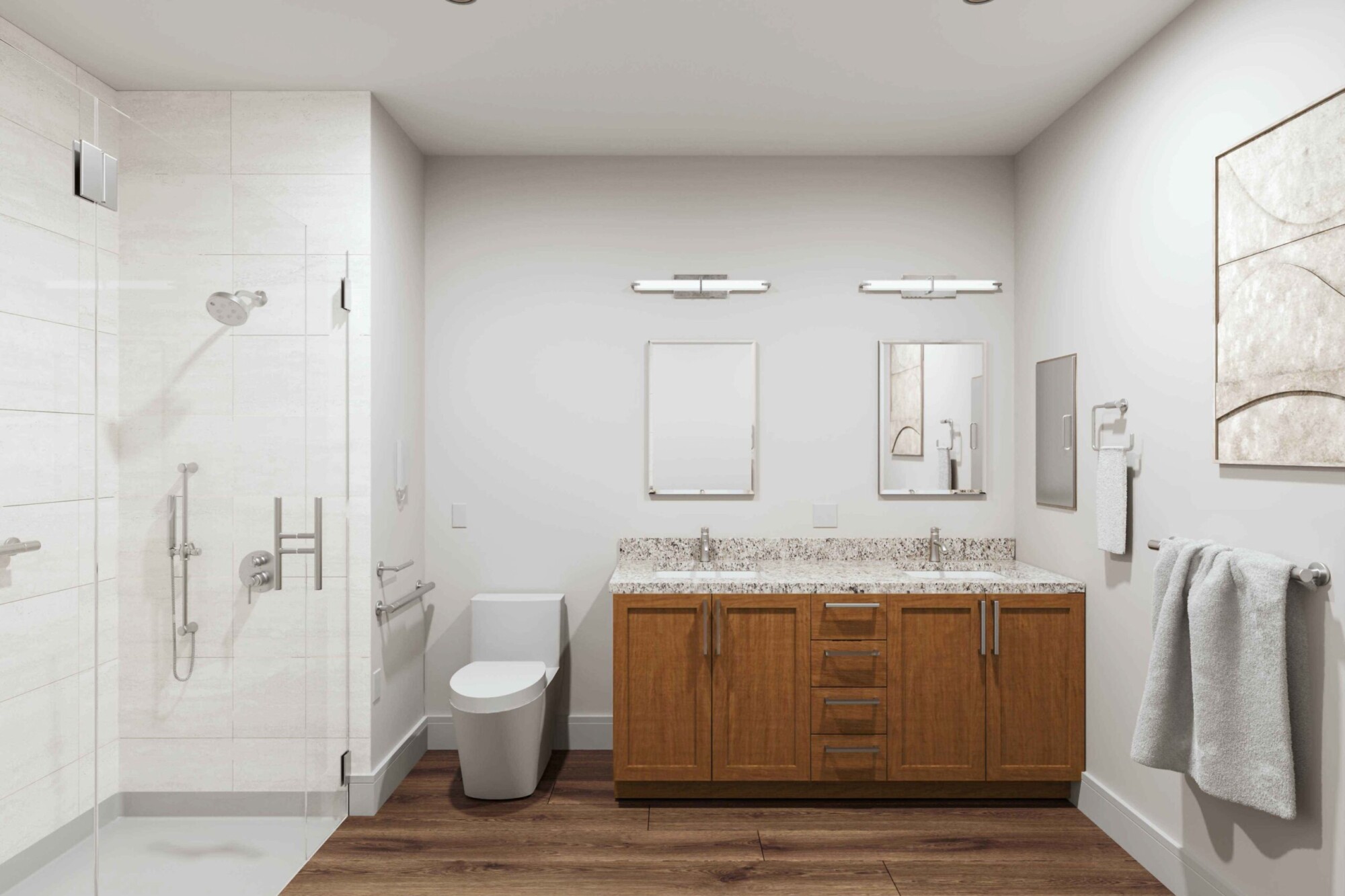 Accessible sample apartment bathroom with a large glass-enclosed walk-in shower, wall-mounted grab bars, toilet and long double-sink vanity with wood cabinetry and stone countertop. The spacious room has wide floor space, wood-look flooring, mirrors and bright recessed lighting.